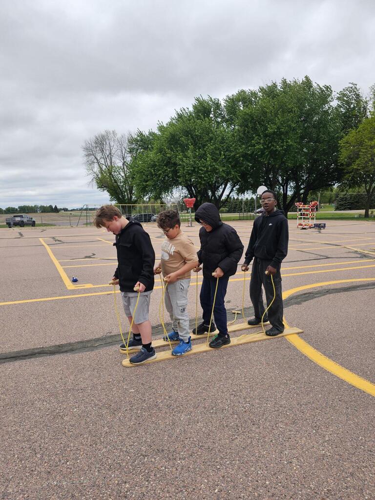 4 boys on the ski walk