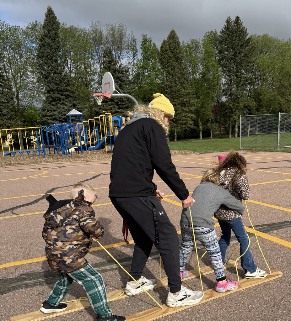 Teacher and 3 kinder students on the ski walk