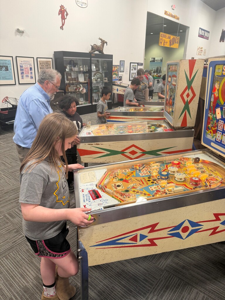 kids playing pinball