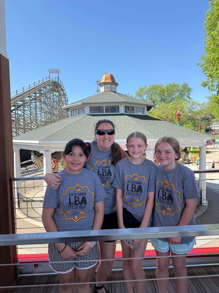 teacher and students in front of a gazebo