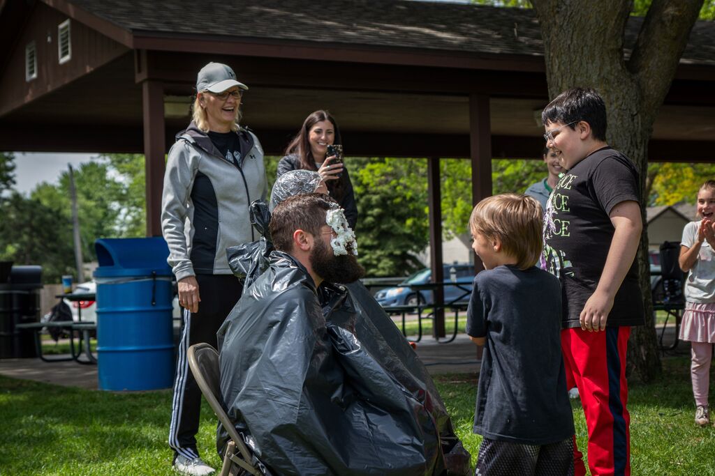 students pieing a teacher
