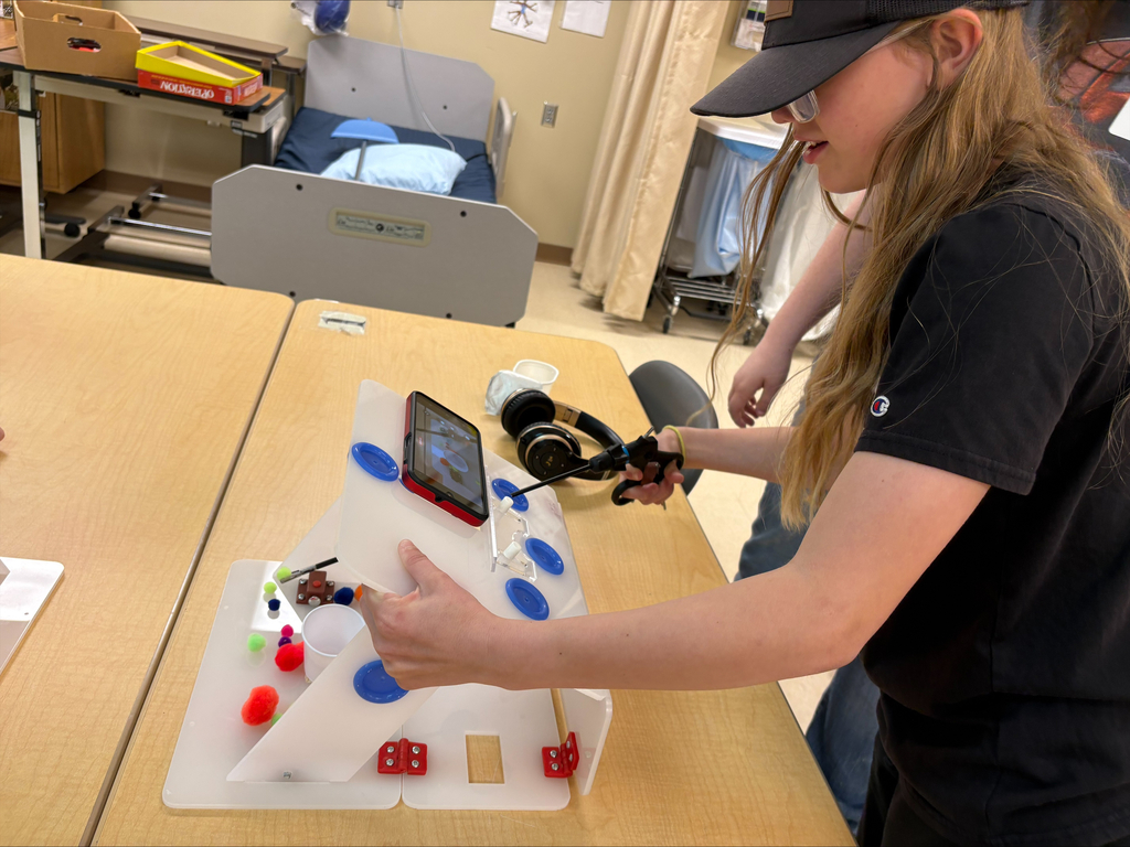 Student using medical equipment