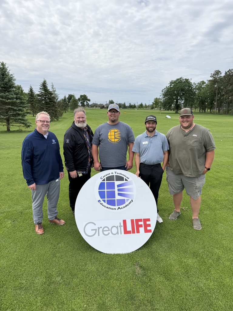 CTE staff with Great Life staff accepting the sign