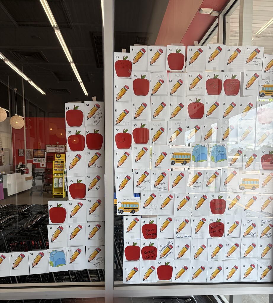 donation slips posted in the front window of store