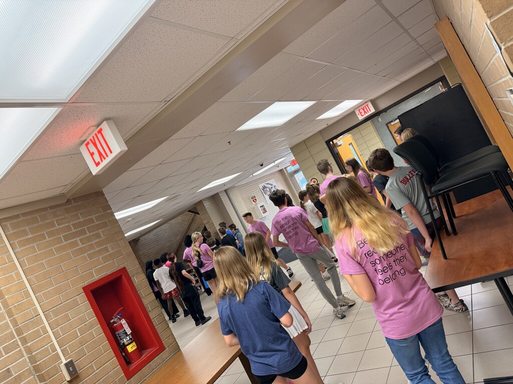 web leaders and 6th graders packing the hall