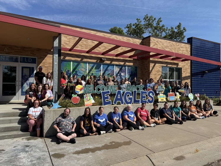 EFA+ staff in front of the entrance