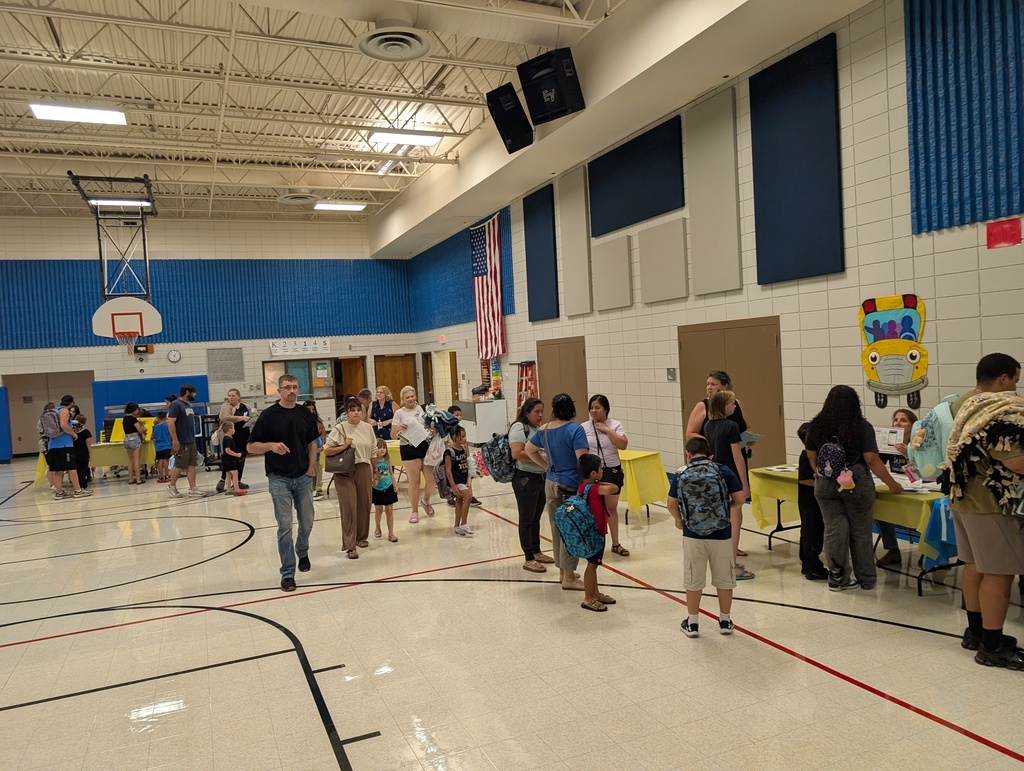 Families in a school gymnasium