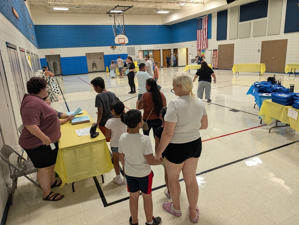 Families in a school gymnasium