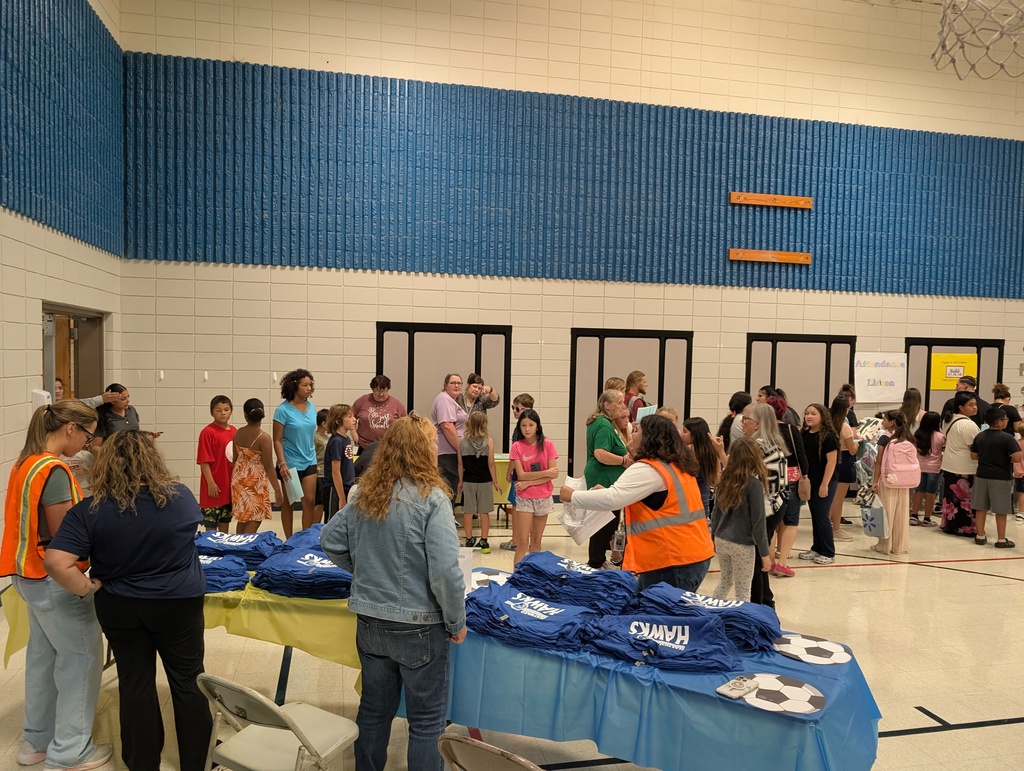 Families in a school gymnasium