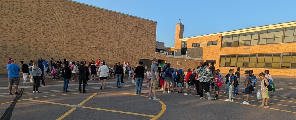 students lined up waiting to start their first day of school