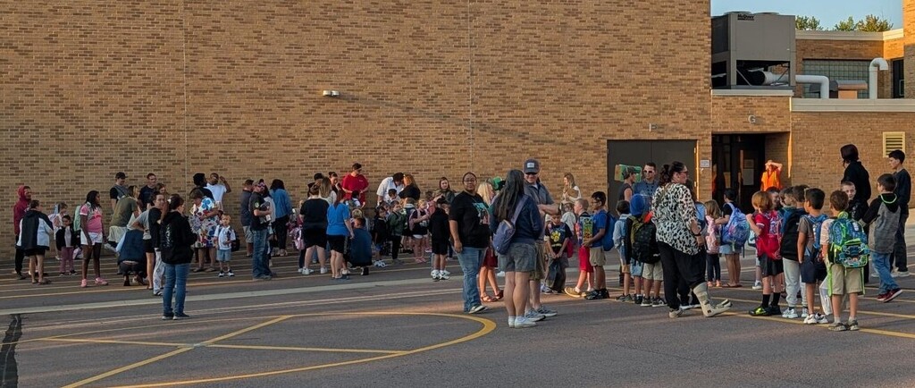 students lined up waiting to start their first day of school