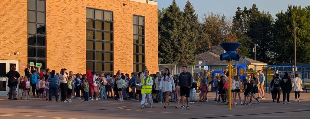 students lined up waiting to start their first day of school