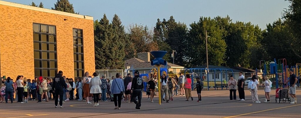 students lined up waiting to start their first day of school