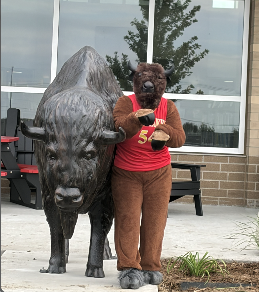 Mascot and Benny outside Ben Reifel