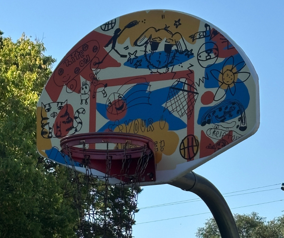 A close up of the newly designed basketball hoop backboard at Pioneer Park that hundreds of kids across Sioux Falls help create