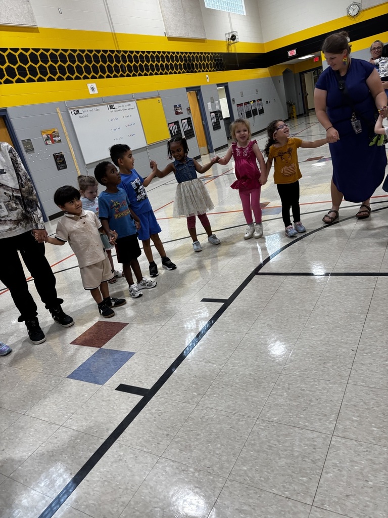 students and teachers singing and dancing
