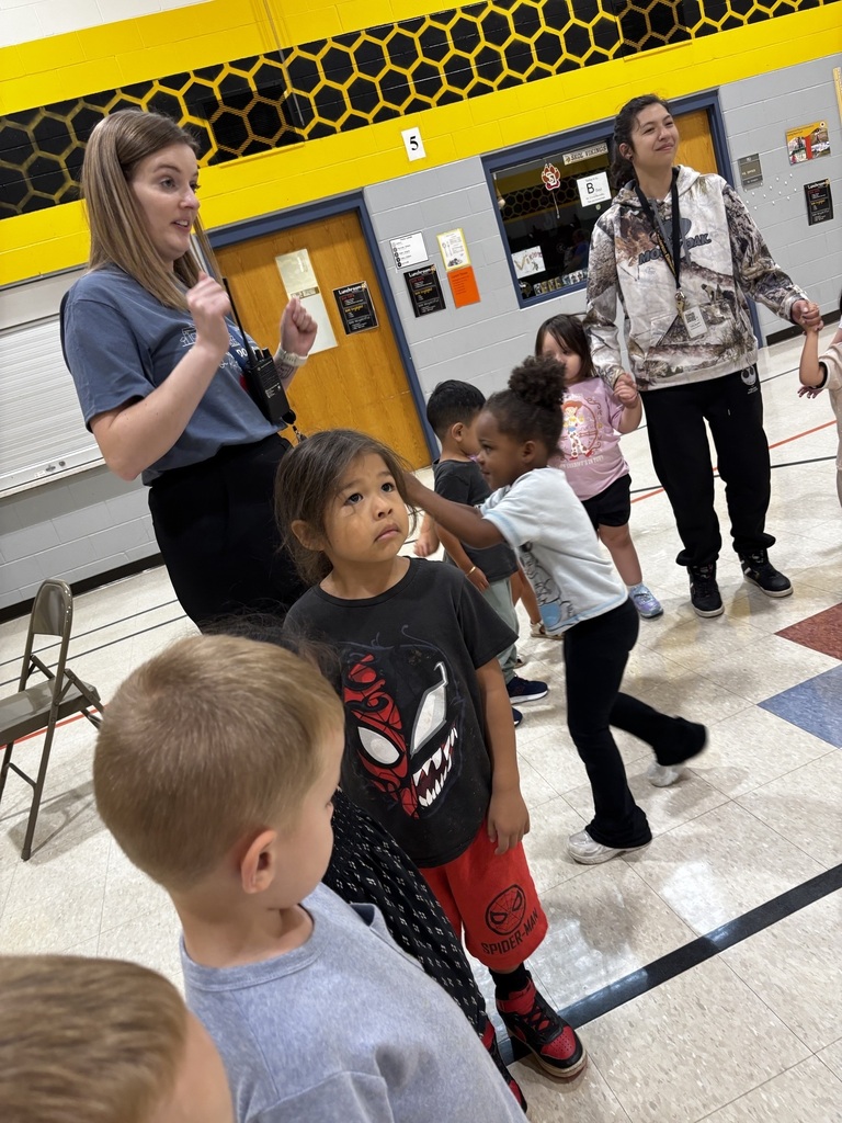 students and teachers singing and dancing
