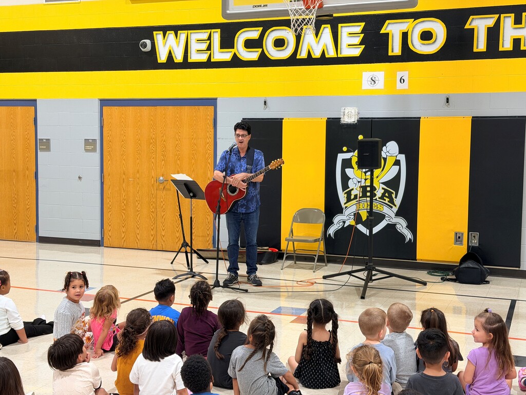 Phil Baker with his guitar 