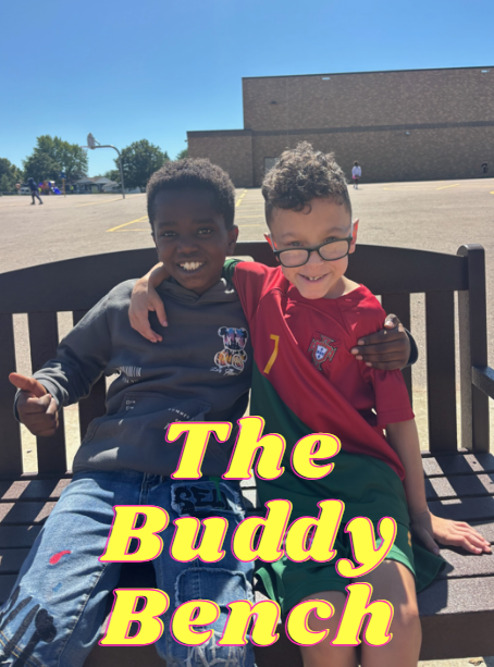 Two kids using the buddy bench.
