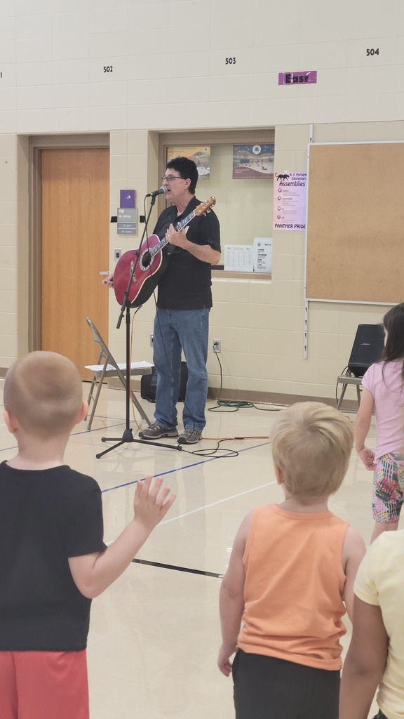 Phil Baker performs for our early childhood learners