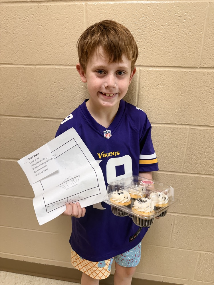 a photo of a student holding a package of cupcakes and a drawing of a cupcake