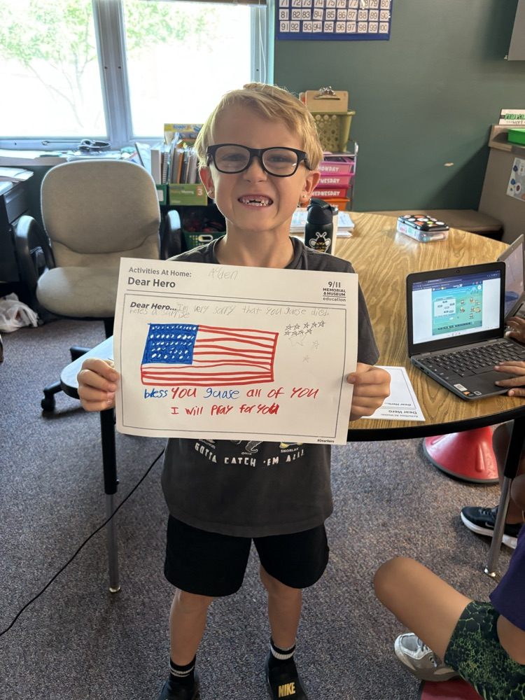 a boy holding his hero letter 