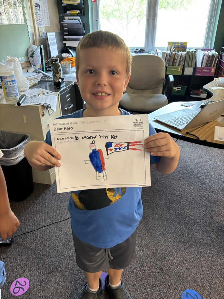 a student holding his hero letter 