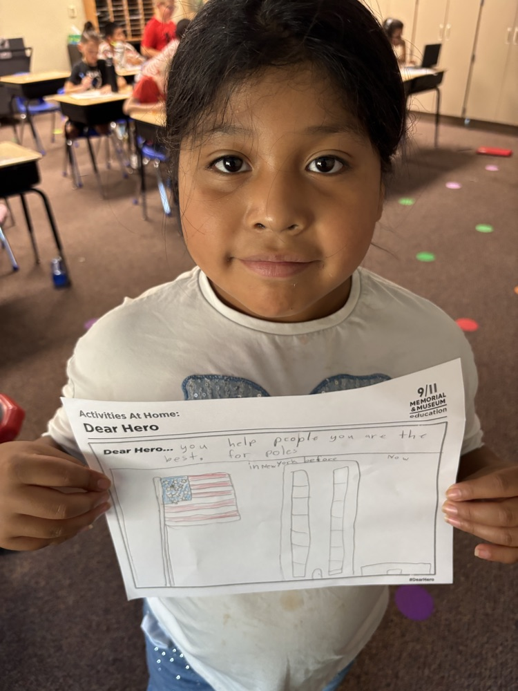 a student holding a hero letter 