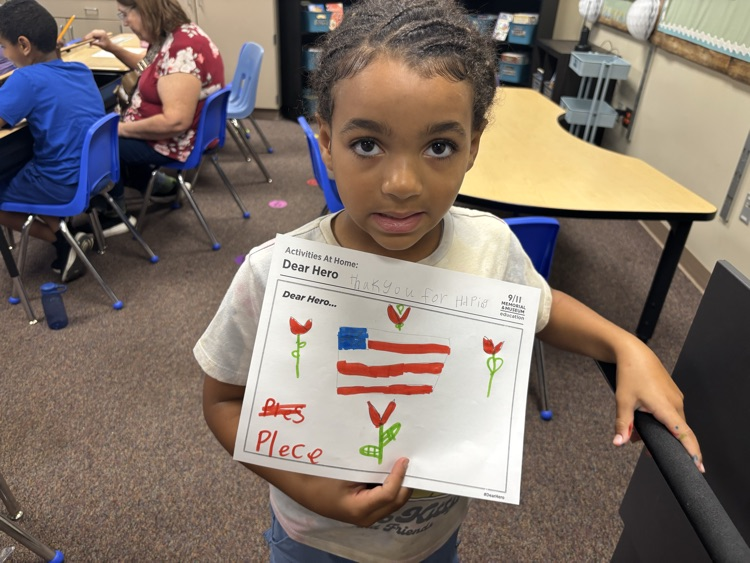 a student showing their hero letter 