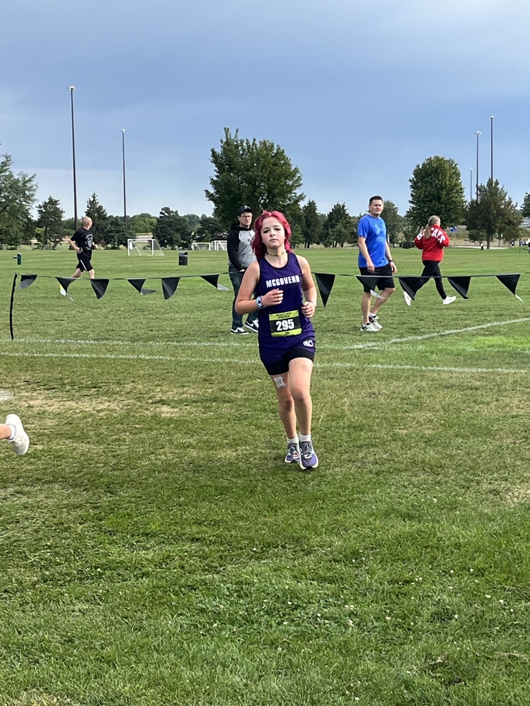 Cross country athlete running at the Nike Heartland Preview.