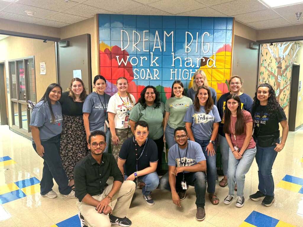 Spanish and two way immersion teachers in front of the new mural