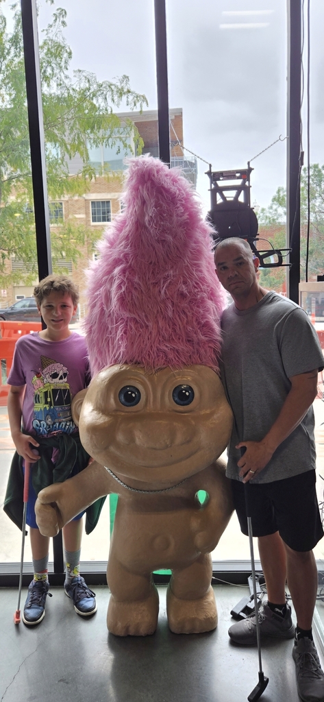 Mr. Stansbury with a troll and one of his children.