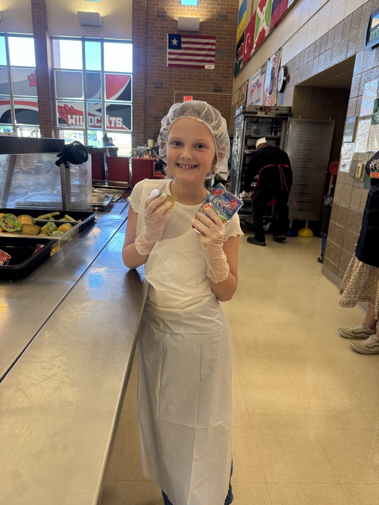 a girl serving juice 