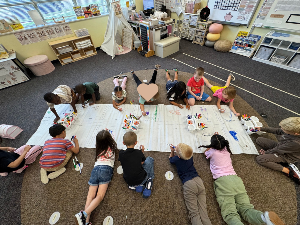 Students on the floor making a class map.