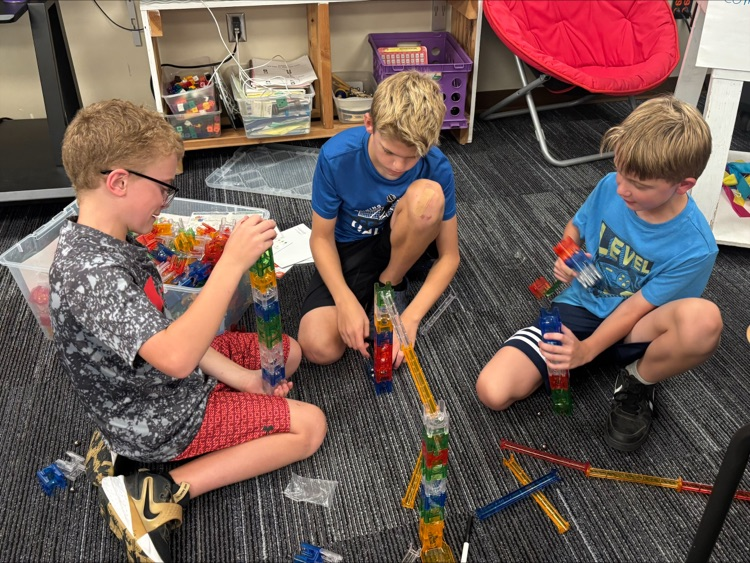 students building a marble run