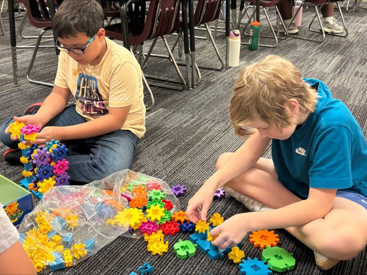 students playing colorful blocks