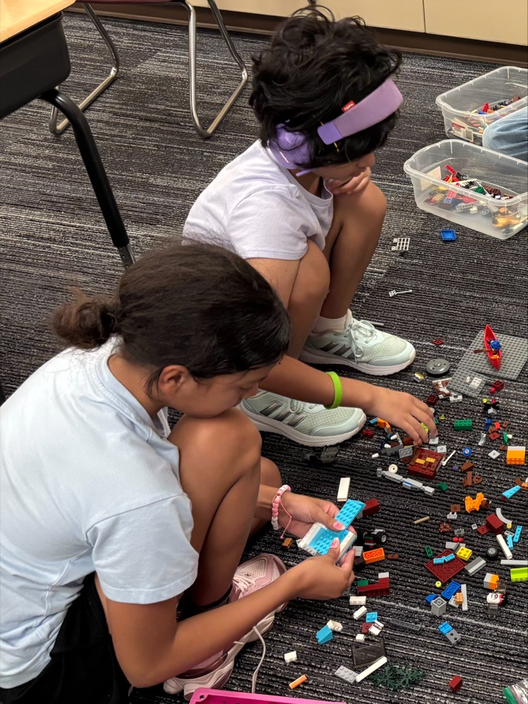 students building with legos