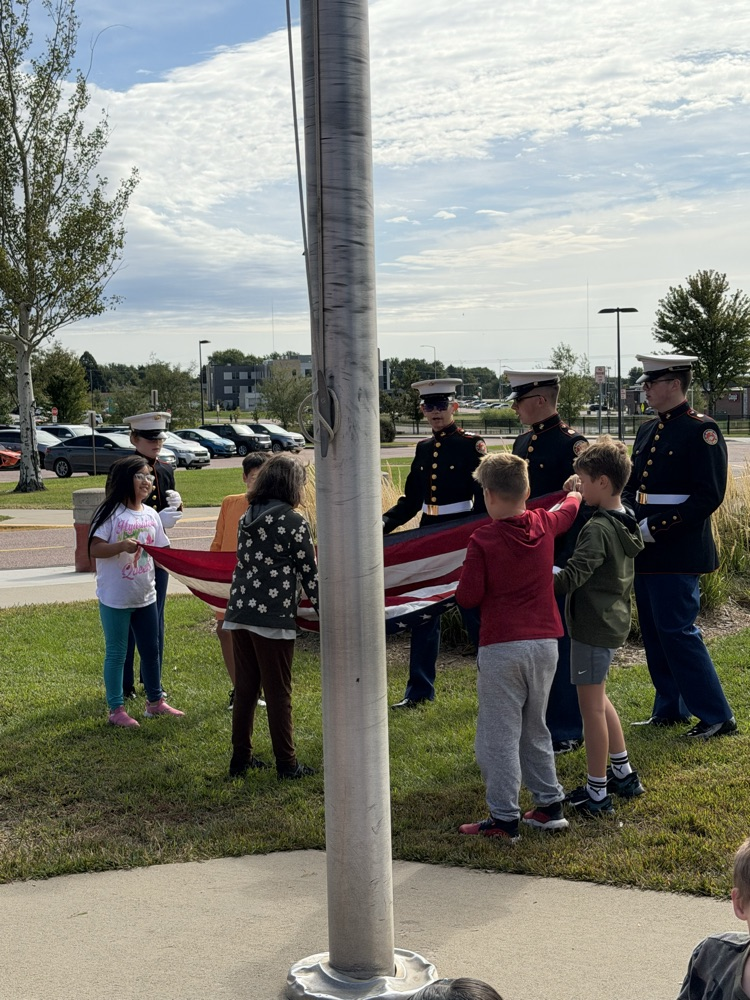 students holding the flag 