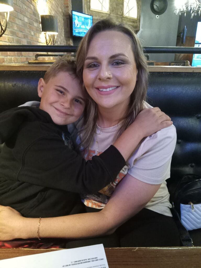 Ms. Whitney and her son sitting together.