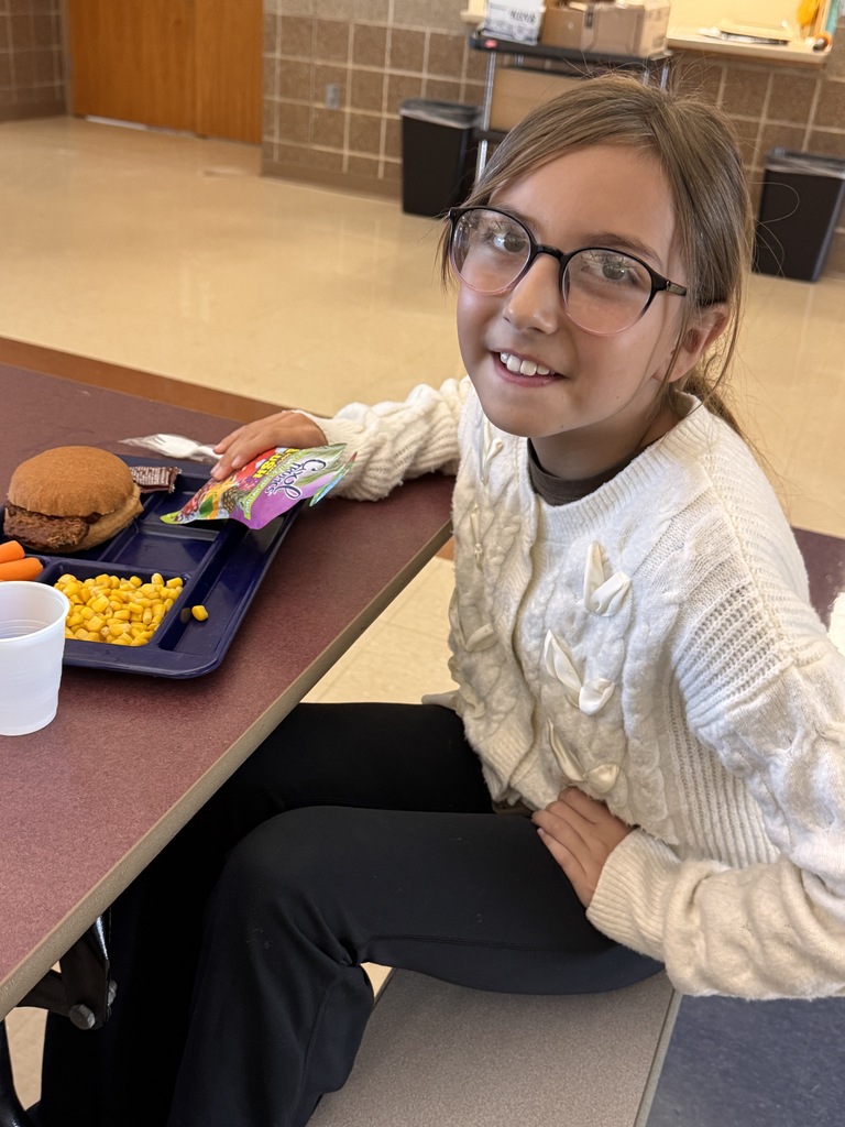 Student eating a hot lunch