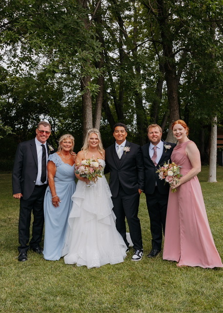 Mrs. Skogstad at her daughters wedding. She is in light blue.