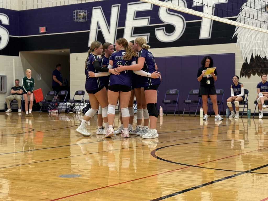 Volleyball team huddled up. 