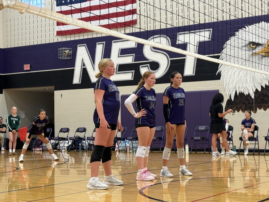 3 volleyball players waiting for the serve. 