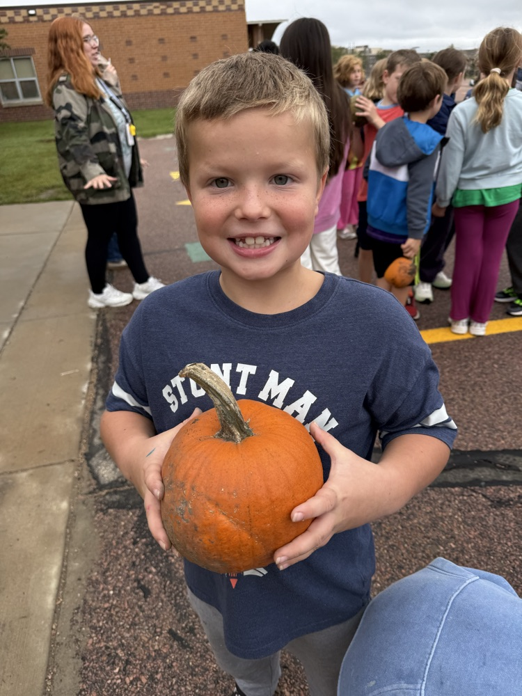 a student with their pumpkin 