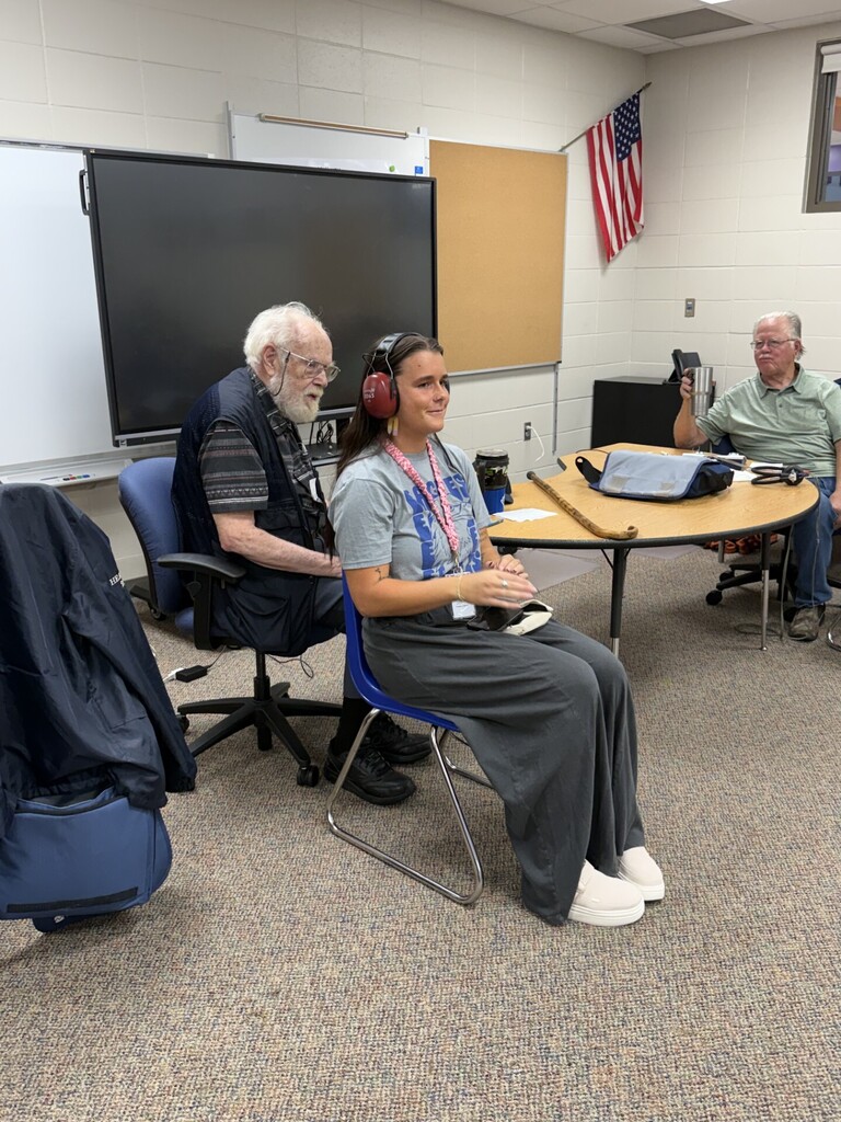 Ms. Hart getting her hearing tested. 