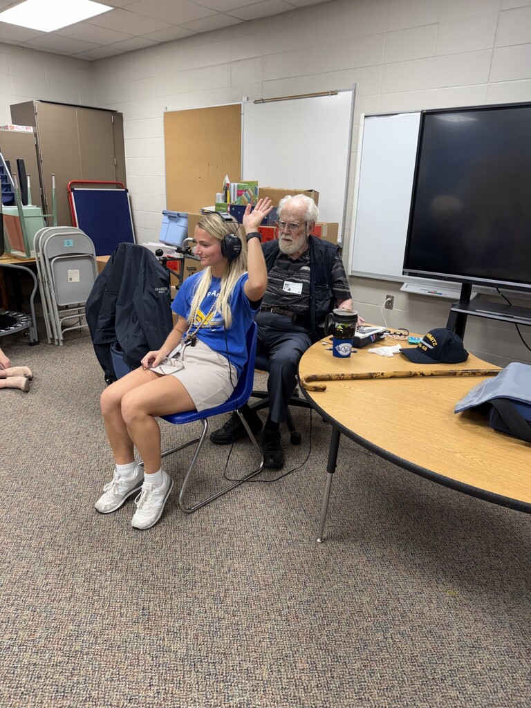 Ms. Schwartz getting her hearing tested. 