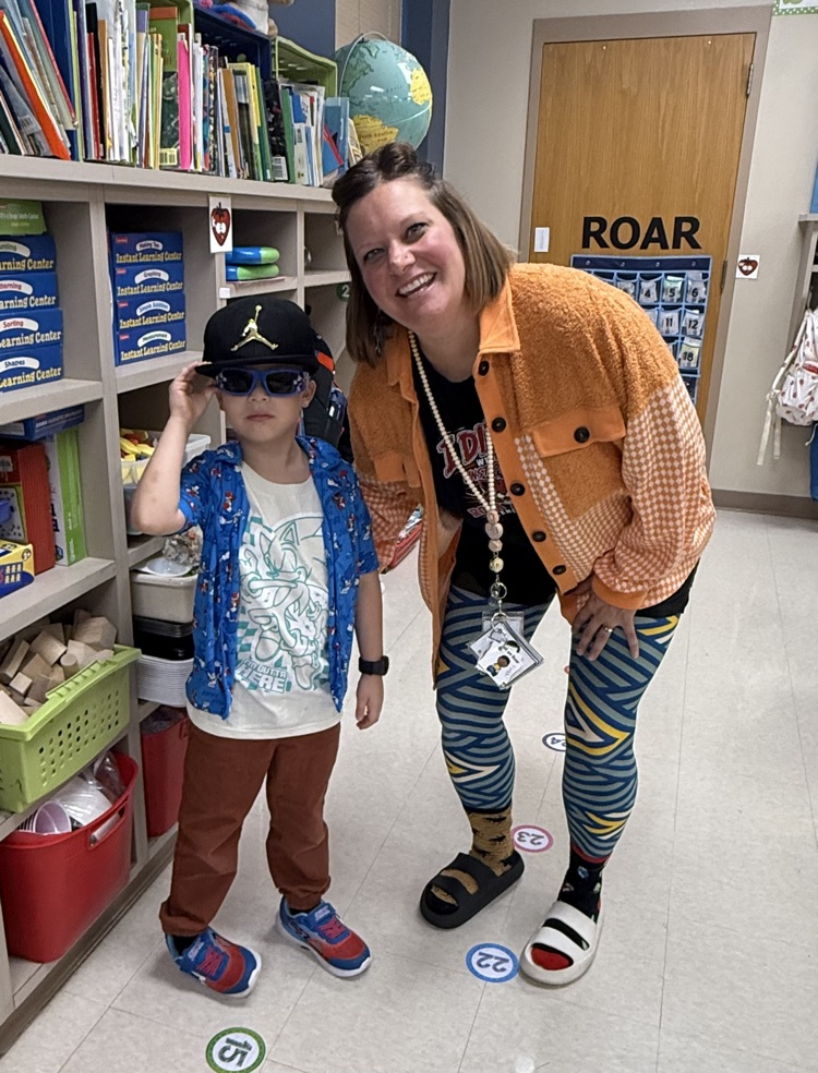 a teacher and a student dressed in crazy clothes