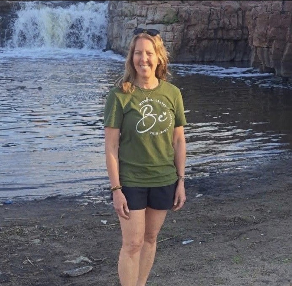 Ms. Reich outside by the water.
