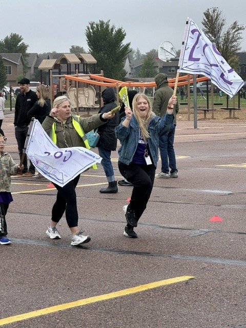 Staff  outside enjoying the fun run