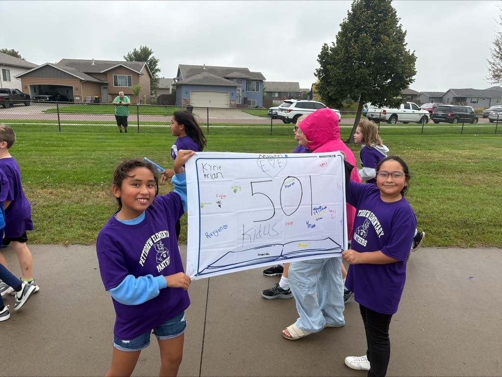 Students holding banner at the fun run